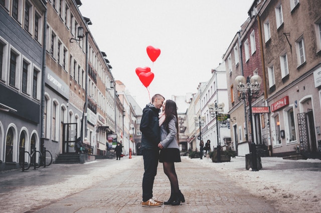 couple-walking-on-city-street-307791